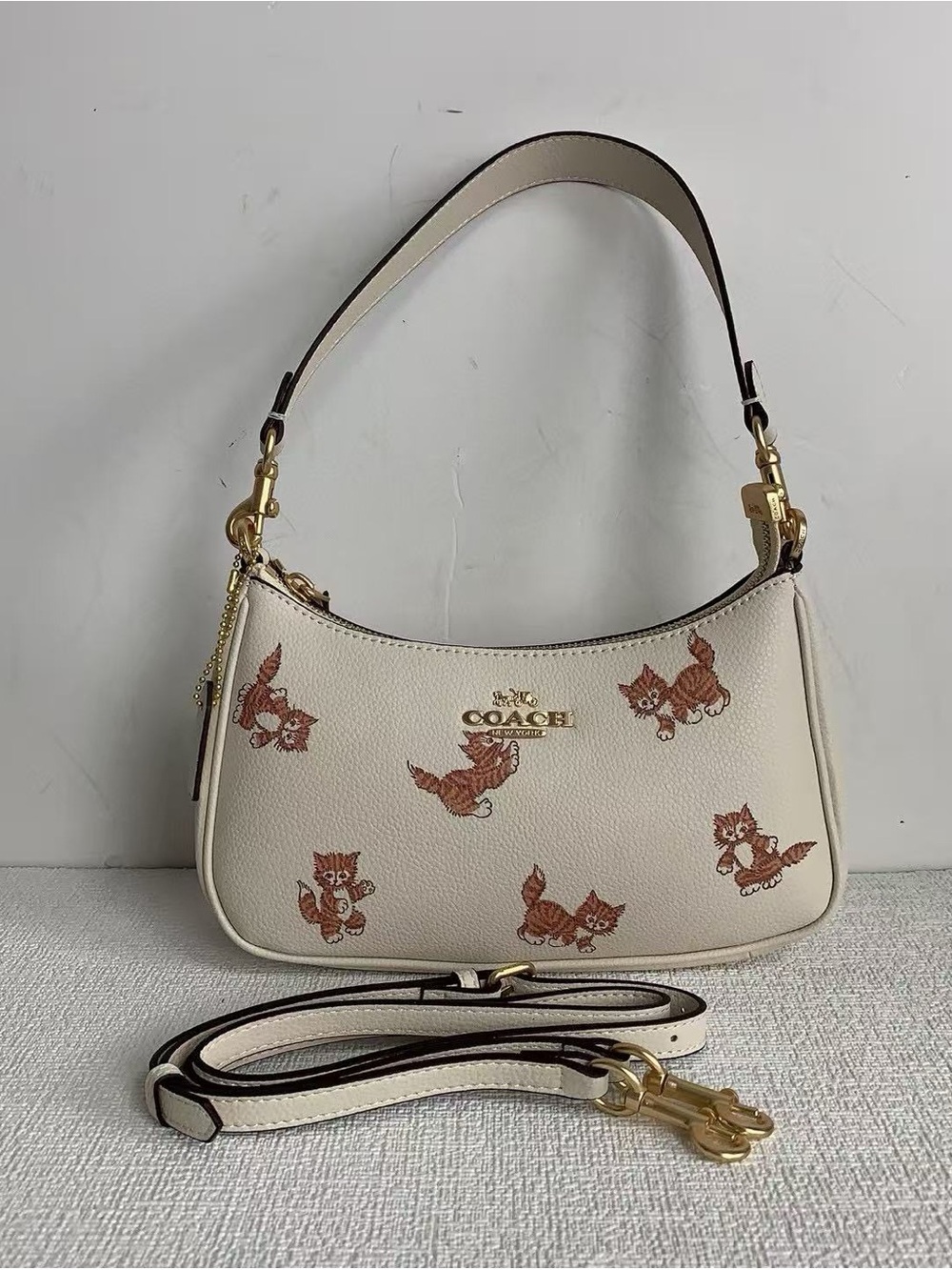 Coach Cream Leather Shoulder Bag with Brown Cat Motif and Gold Hardware